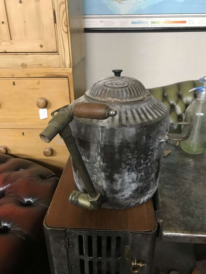 A cast iron Aga urn with brass tap by Holcroft