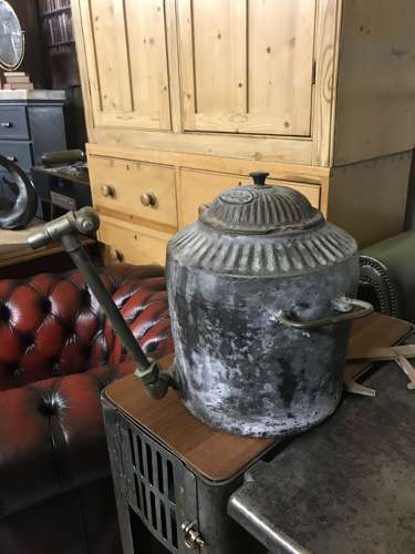 A cast iron Aga urn with brass tap by Holcroft