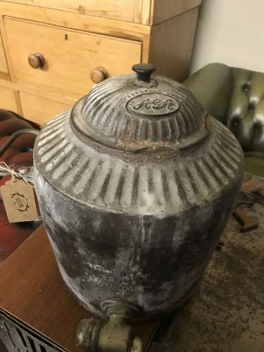 A cast iron Aga urn with brass tap by Holcroft