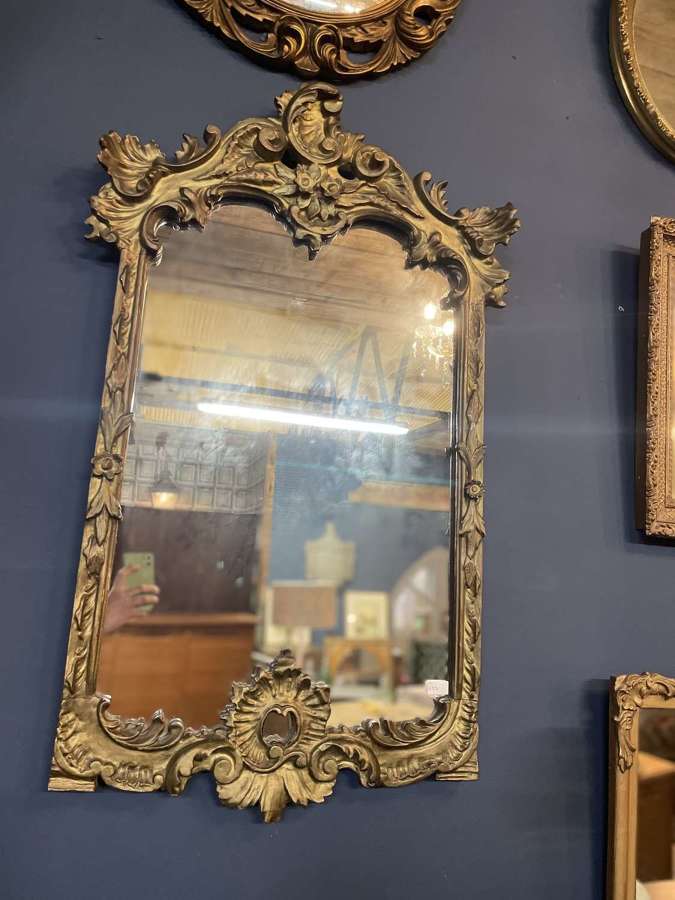 Ornate gilt framed mirror