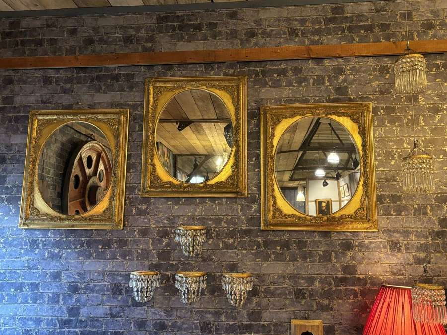Regency Style Oval Wall Mirror in Embossed Gilt frame
