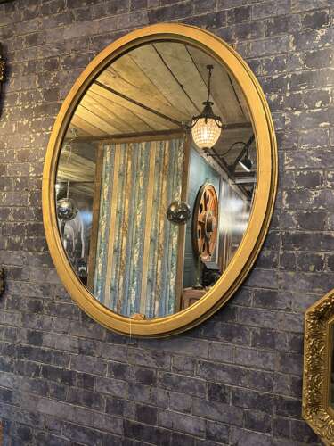 Large Oval mirror in Gilt.