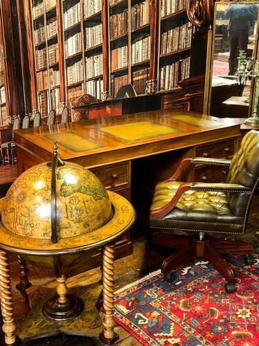 Antique Walnut pedestal desk with a hinged compartment desk with olive green leather top.