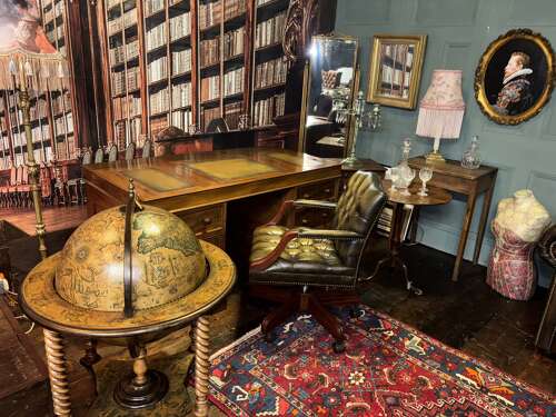 Antique Walnut pedestal desk with a hinged compartment desk with olive green leather top.