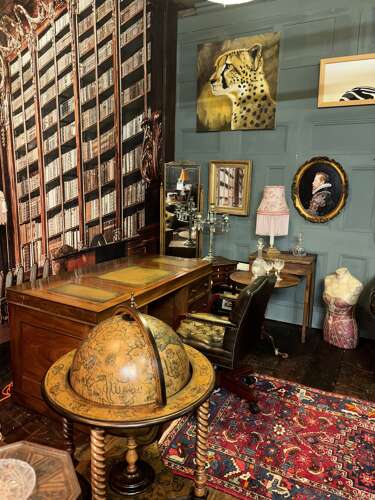 Antique Walnut pedestal desk with a hinged compartment desk with olive green leather top.
