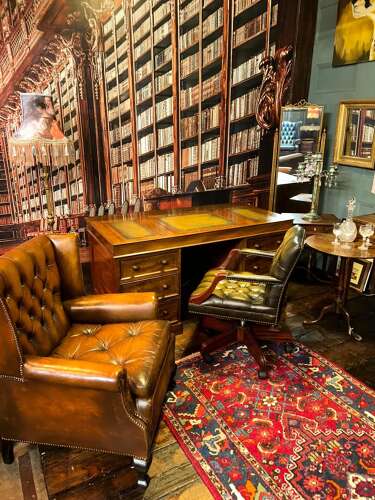 Antique Walnut pedestal desk with a hinged compartment desk with olive green leather top.