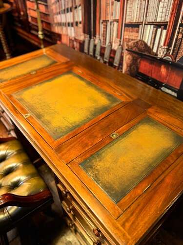 Antique Walnut pedestal desk with a hinged compartment desk with olive green leather top.