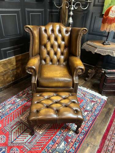 Tan leather Chesterfield wing armchair & matching footstool