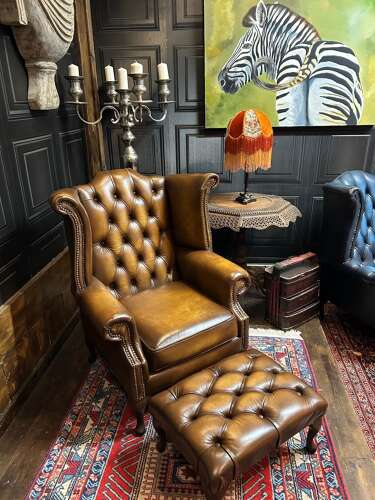 Tan leather Chesterfield wing armchair & matching footstool