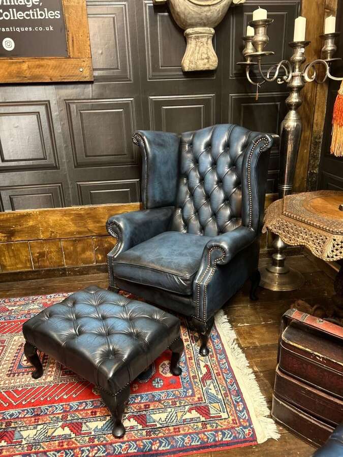 Blue leather Wing armchair with a footstool